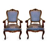 A pair of 20th century Louis XV style mahogany armchairs