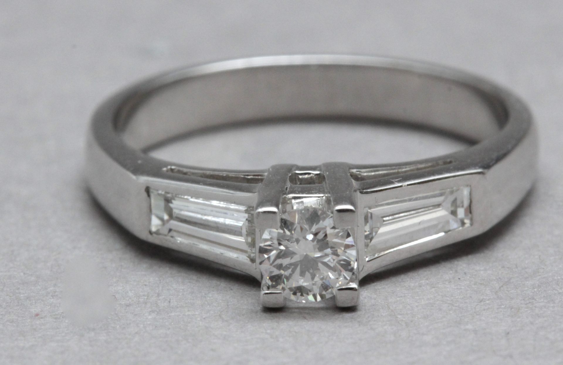 A three stone diamond engagement ring