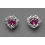 A diamond and rubies heart shaped stud earrings