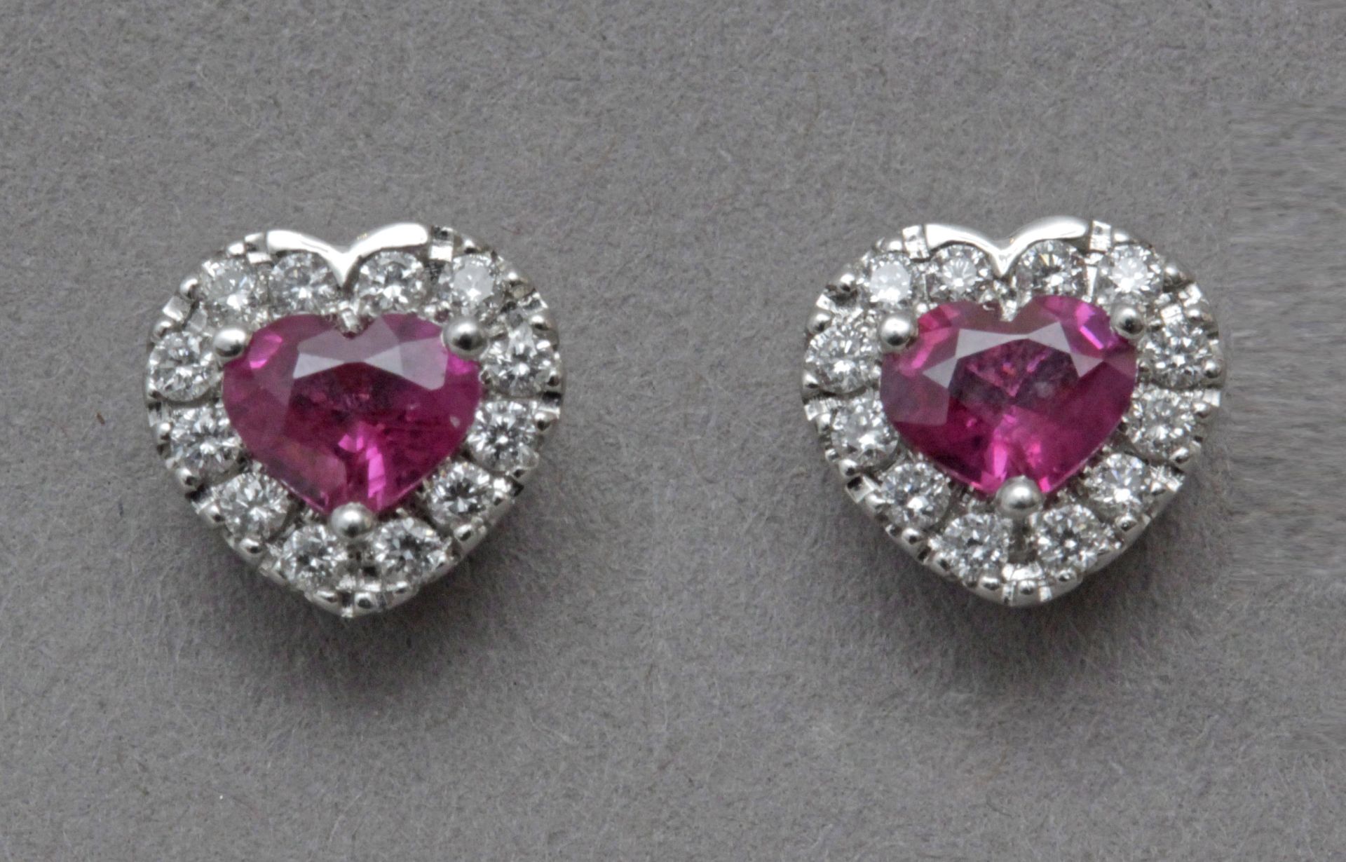 A diamond and rubies heart shaped stud earrings