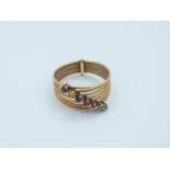 An 18k. yellow gold ring and colour stones