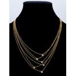 A six strand 18k. yellow gold and diamonds necklace