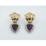 A pair of long earrings with amethysts and diamonds