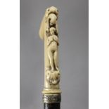 A 19th century European walking stick with a carved ivory handle and and ebony shaft