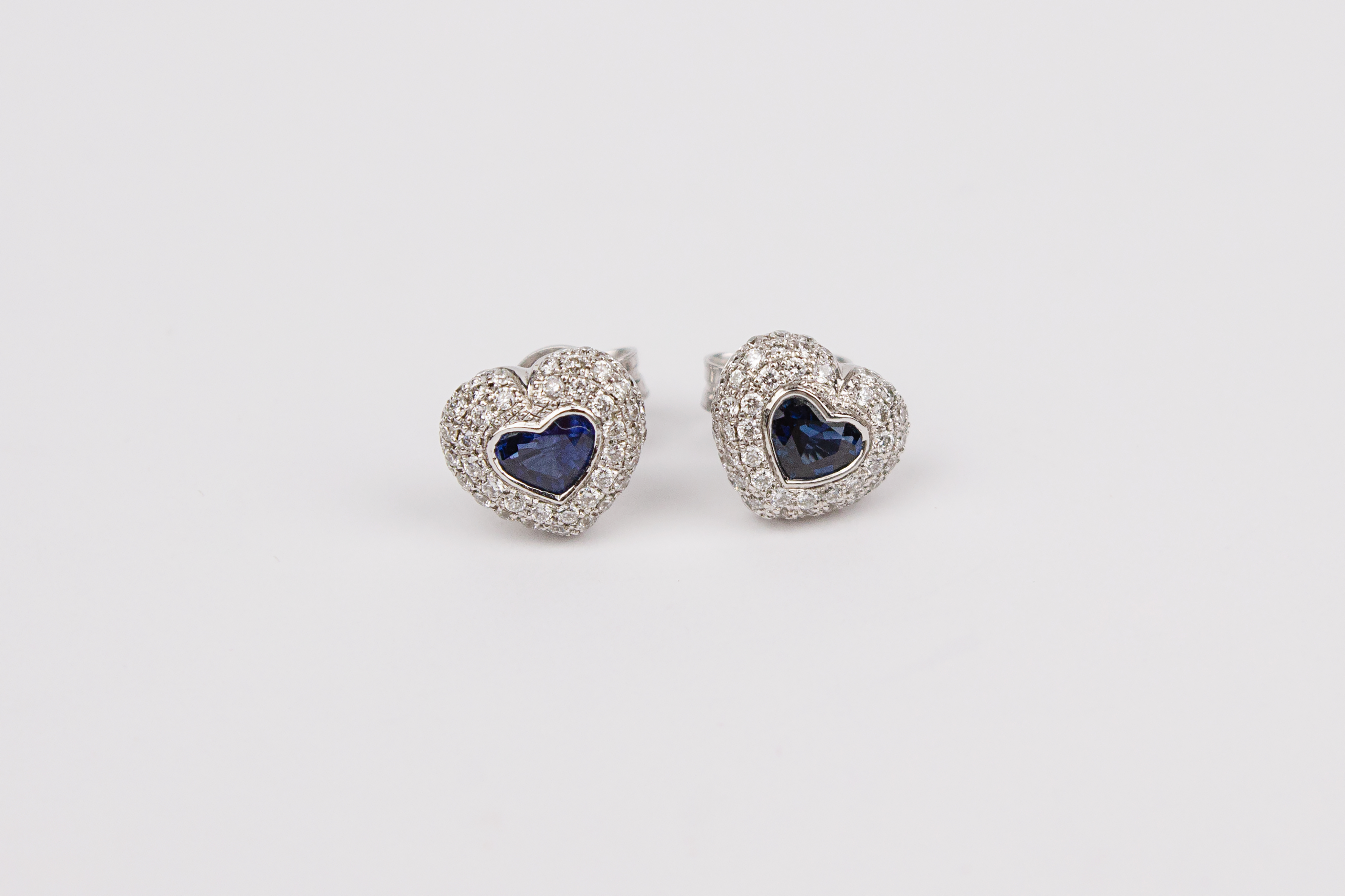 A pair of heart shaped stud earrings