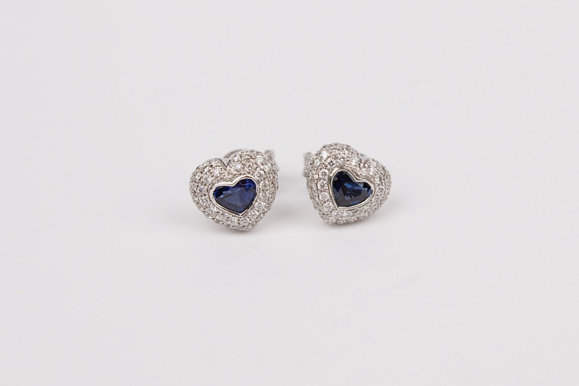 A pair of heart shaped stud earrings