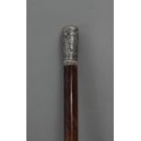 A first third of 20th century baton with a silver handle and a tortoiseshell shaft