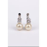 A pair of ‘toi et moi’ brilliant cut diamonds and culture pearls earrings