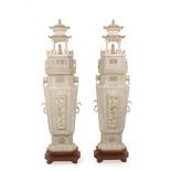 A 20th century Chinese school. A pair of carved ivory pagodas
