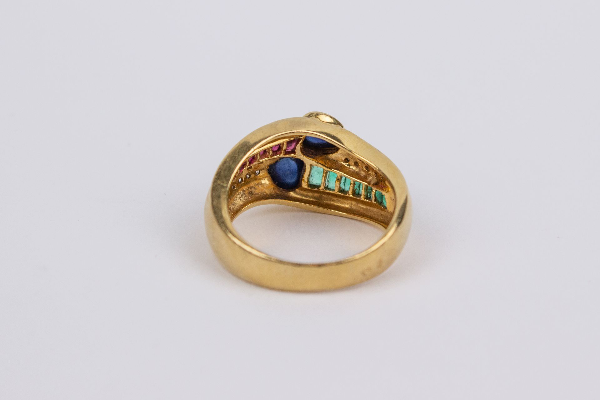 An 18k. yellow gold, sapphires, emeralds, rubies and diamonds ring - Image 2 of 2