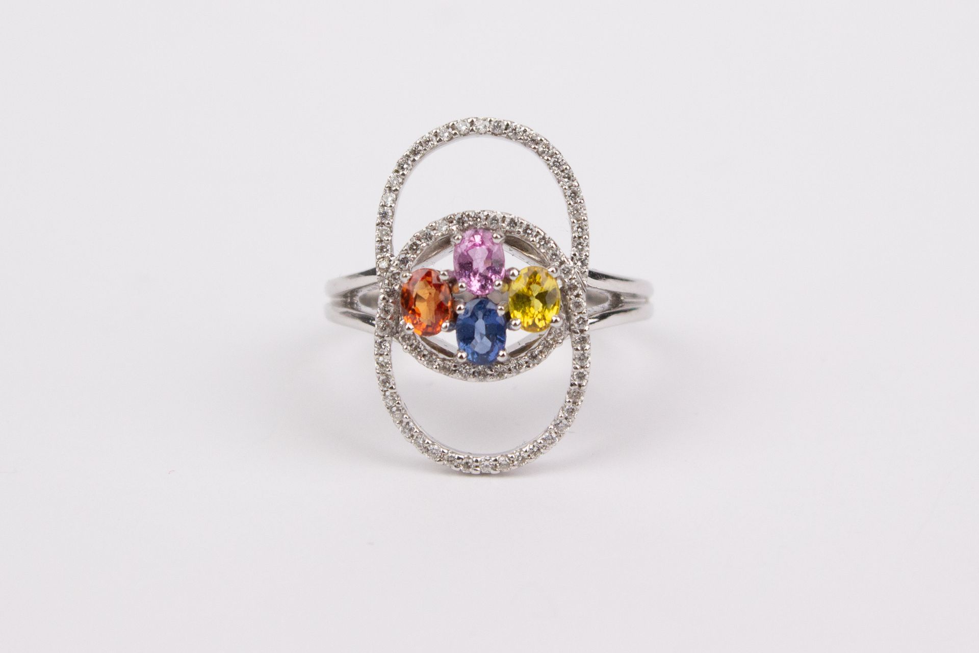 An 18k. yellow gold, sapphires and diamonds ring