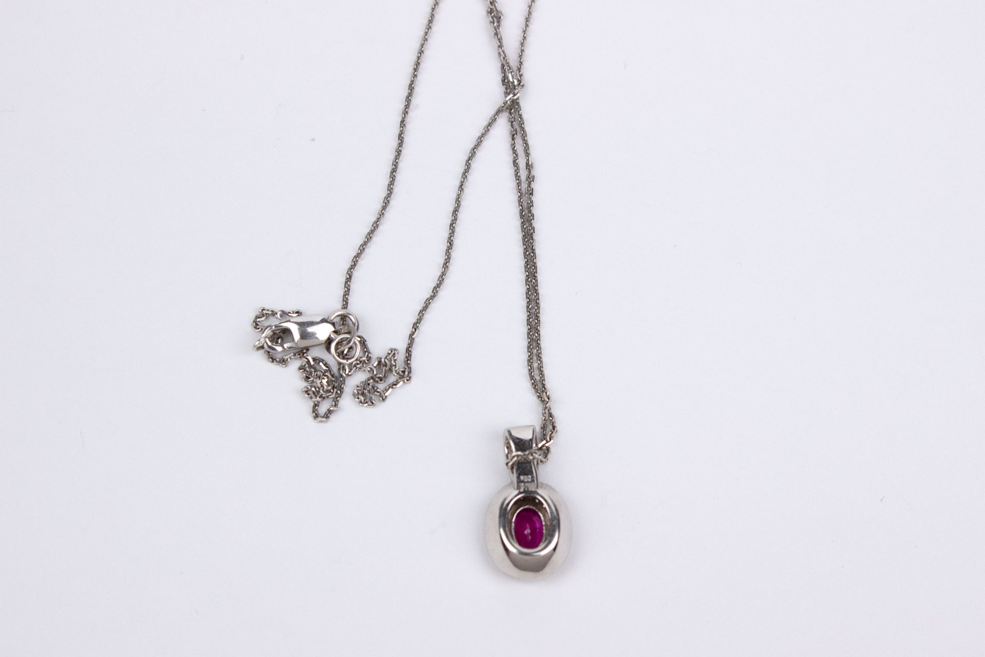 An 18k. white gold, rubies and diamonds cluster pendant and chain - Image 2 of 2