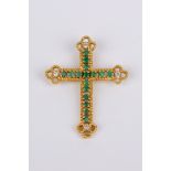 An 18k. yellow gold, brilliant cut diamonds and emeralds pendant cross