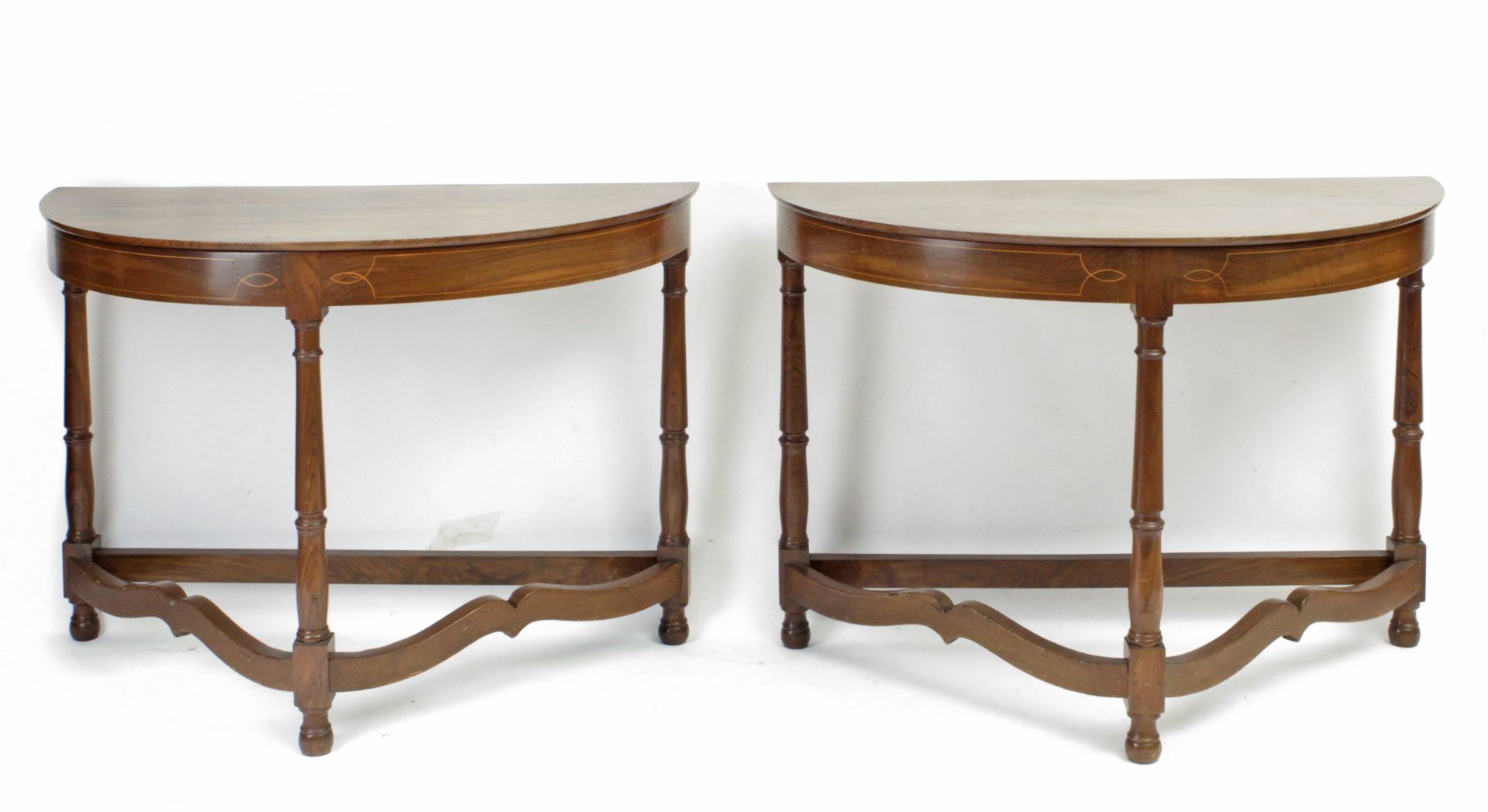 A pair of 20th century Empire style walnut console tables