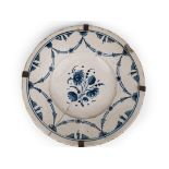 A late 18th century-early 19th century plate in catralan pottery of 'l'arracada'