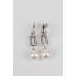 A pair of 18k. white gold, diamonds and cultured pearls long earrings