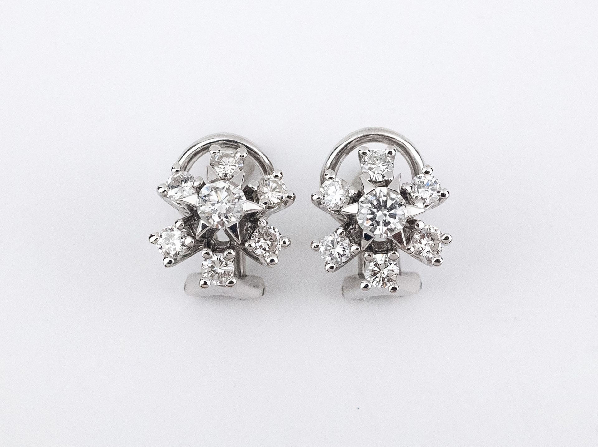 A pair of 18k. white gold and diamonds cluster earrings circa 1970-1980