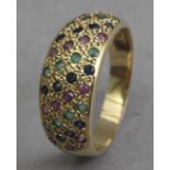 An 18k. Yellow gold, diamonds, emerald and rubies bombe ring