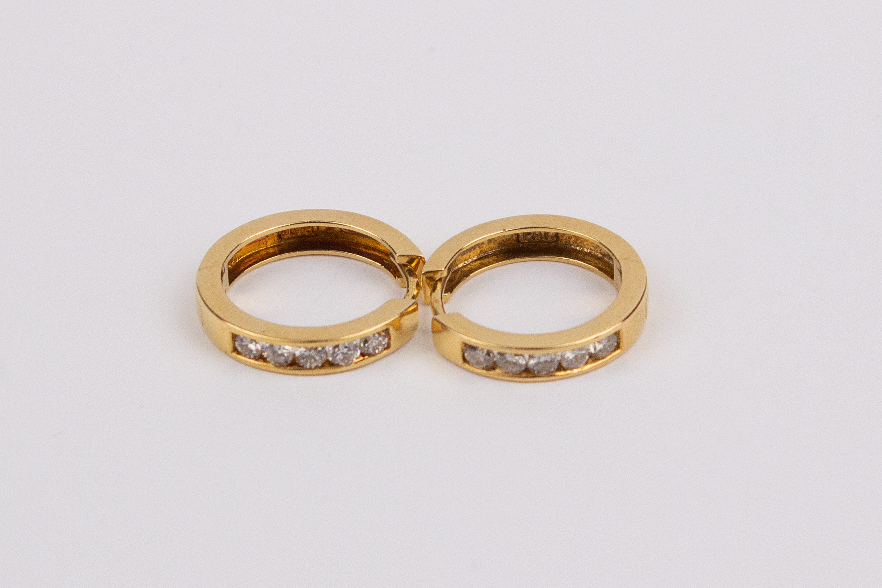 A pair od¡f 18k. Yellow gold and diamonds hoop earrings