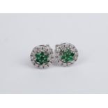 A pair of emerald and diamonds detachable cluster earrings