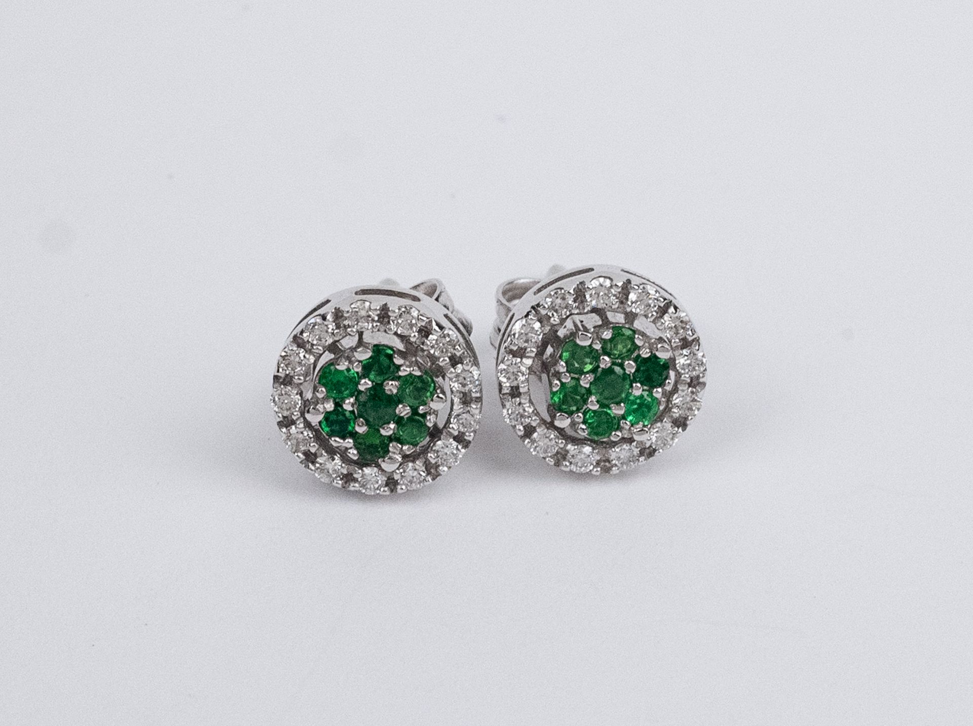 A pair of emerald and diamonds detachable cluster earrings