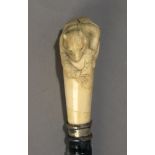 A 19th century Japanese walking stick from Meiji period with carved ivory handle and ebony shaft