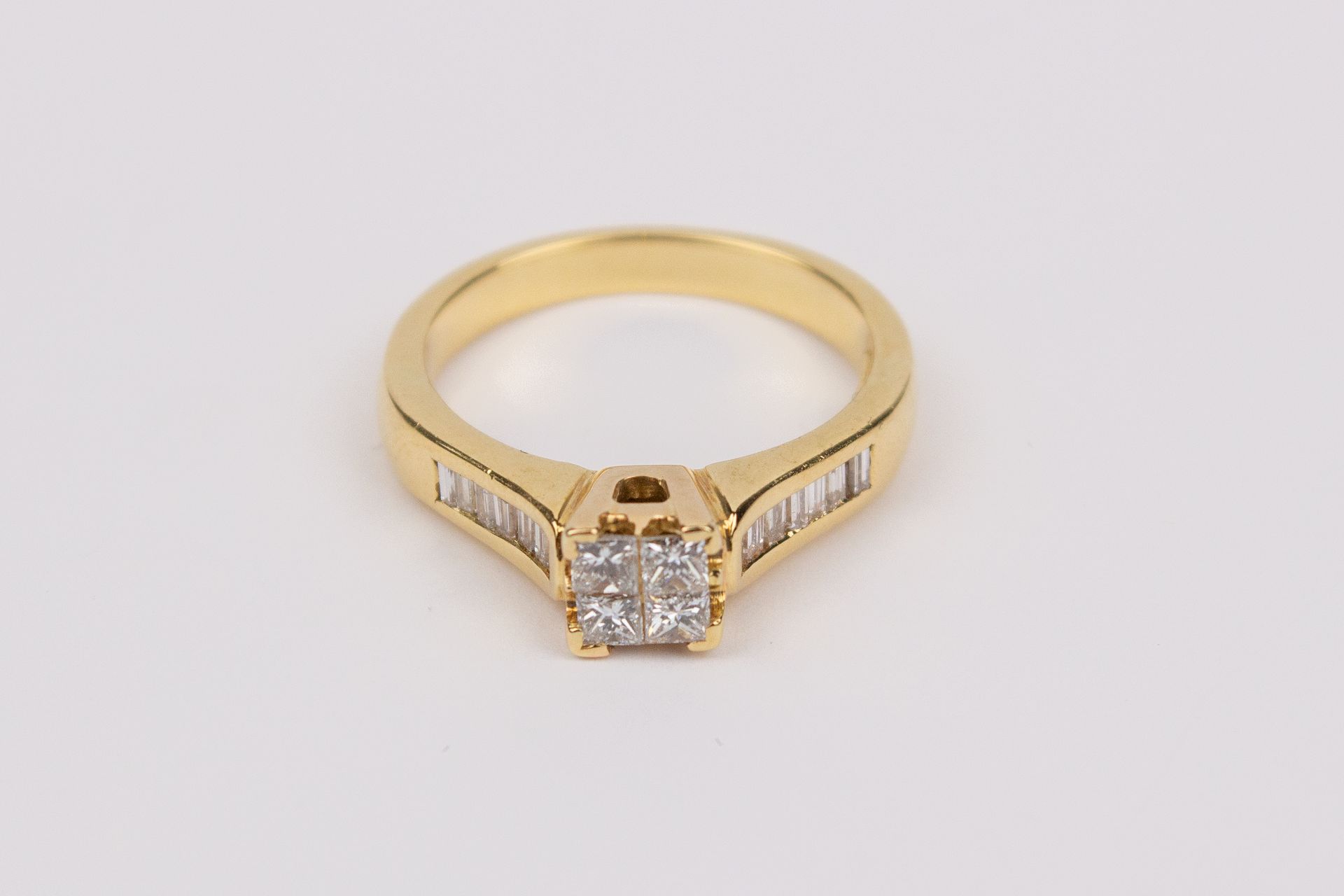 A princess cut diamonds illusion solitaire ring