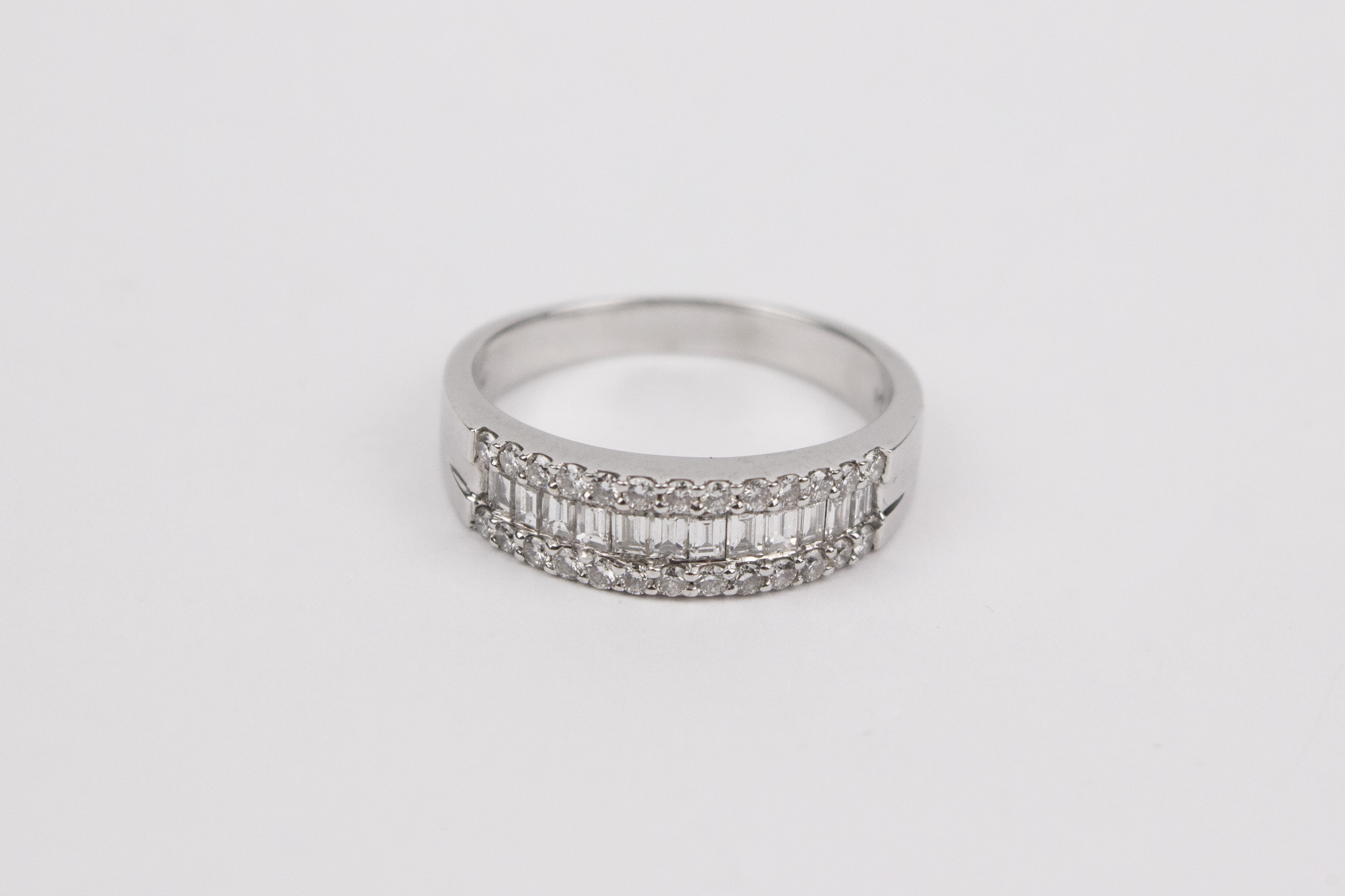 An 18k. white gold and diamonds half eternity ring