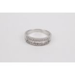 An 18k. white gold and diamonds half eternity ring