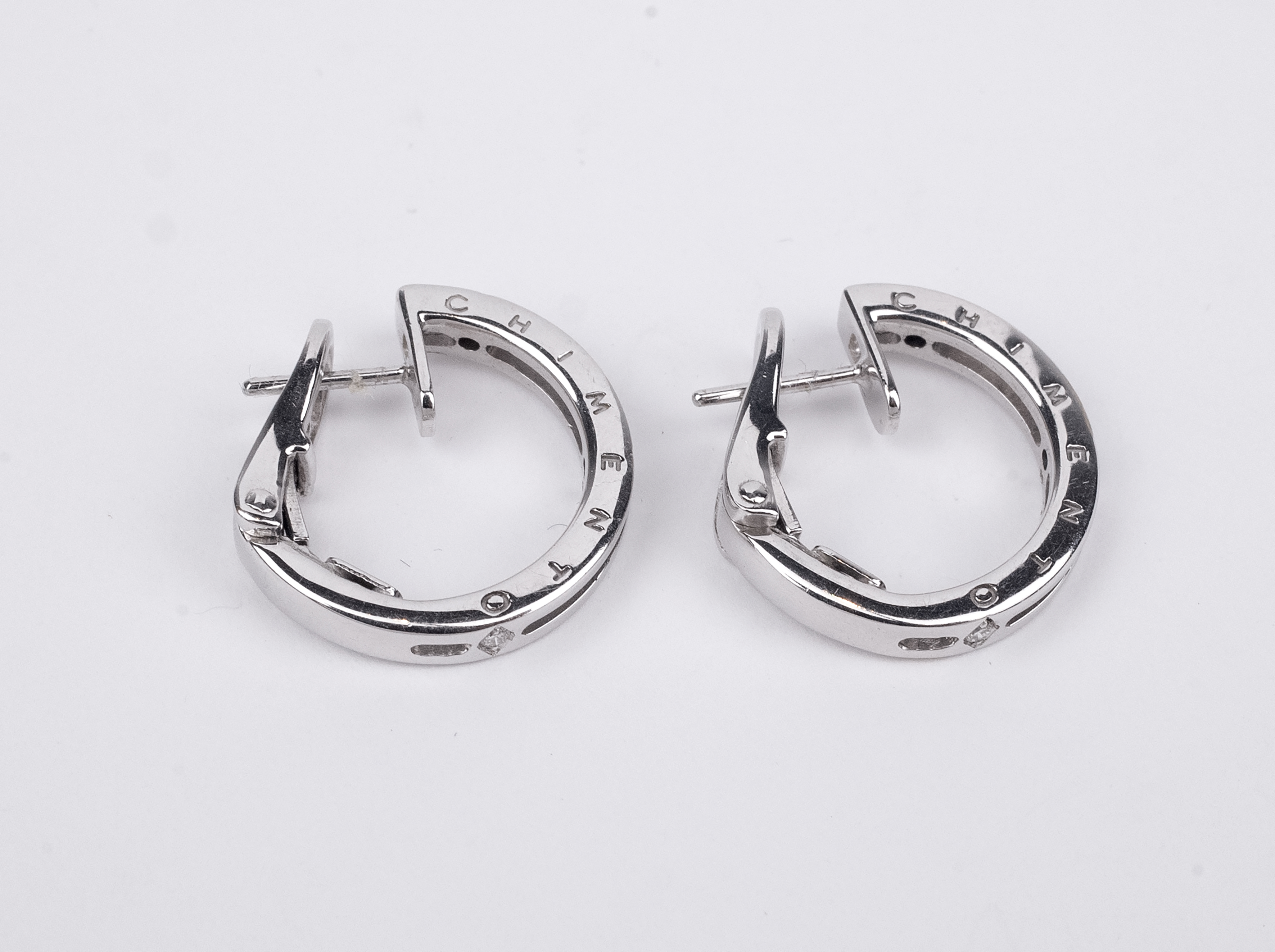 Chimento. A pair of 18k., white gold and diamonds hoop earrings