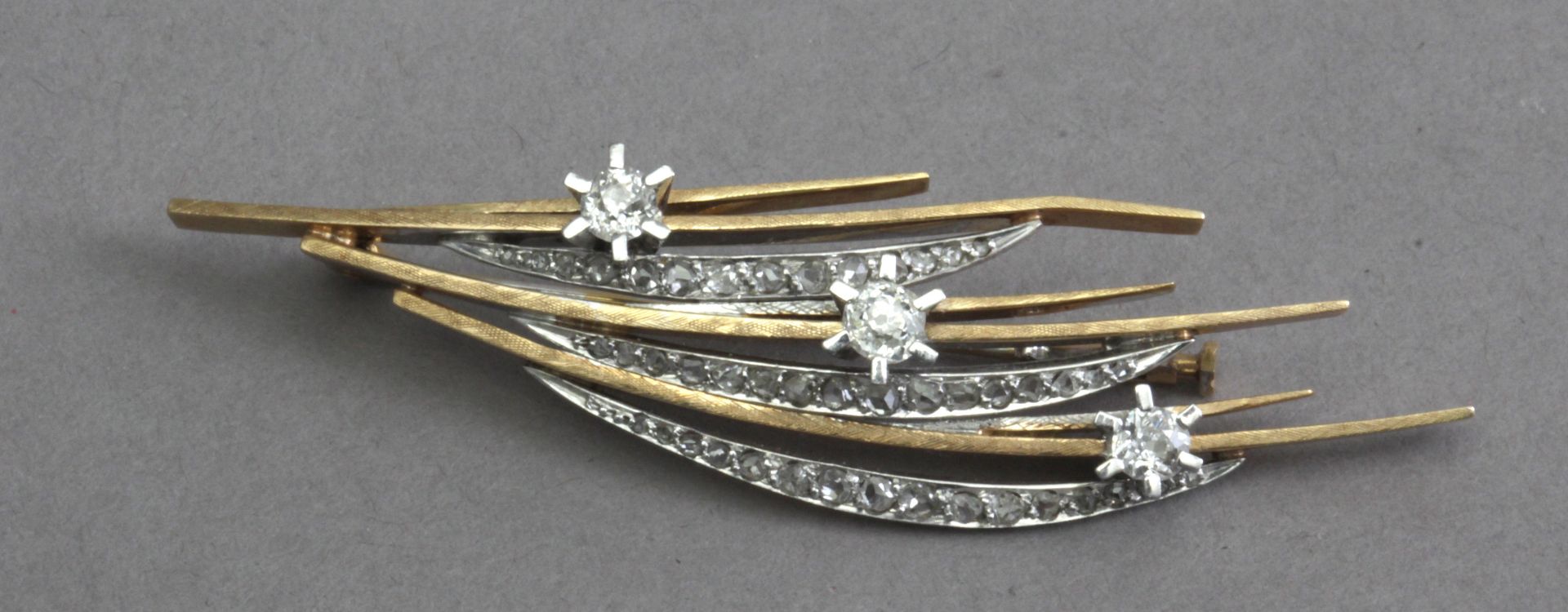 A gold and diamonds brooch