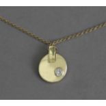 An 18k. yellow gold and brilliant cut diamond pendant and chain