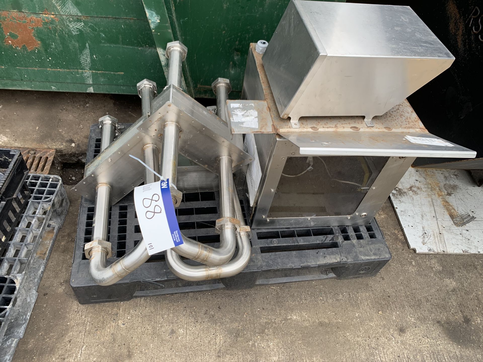 Plastic Pallet, containing three stainless steel trough wall pipes, one stainless steel cabinet