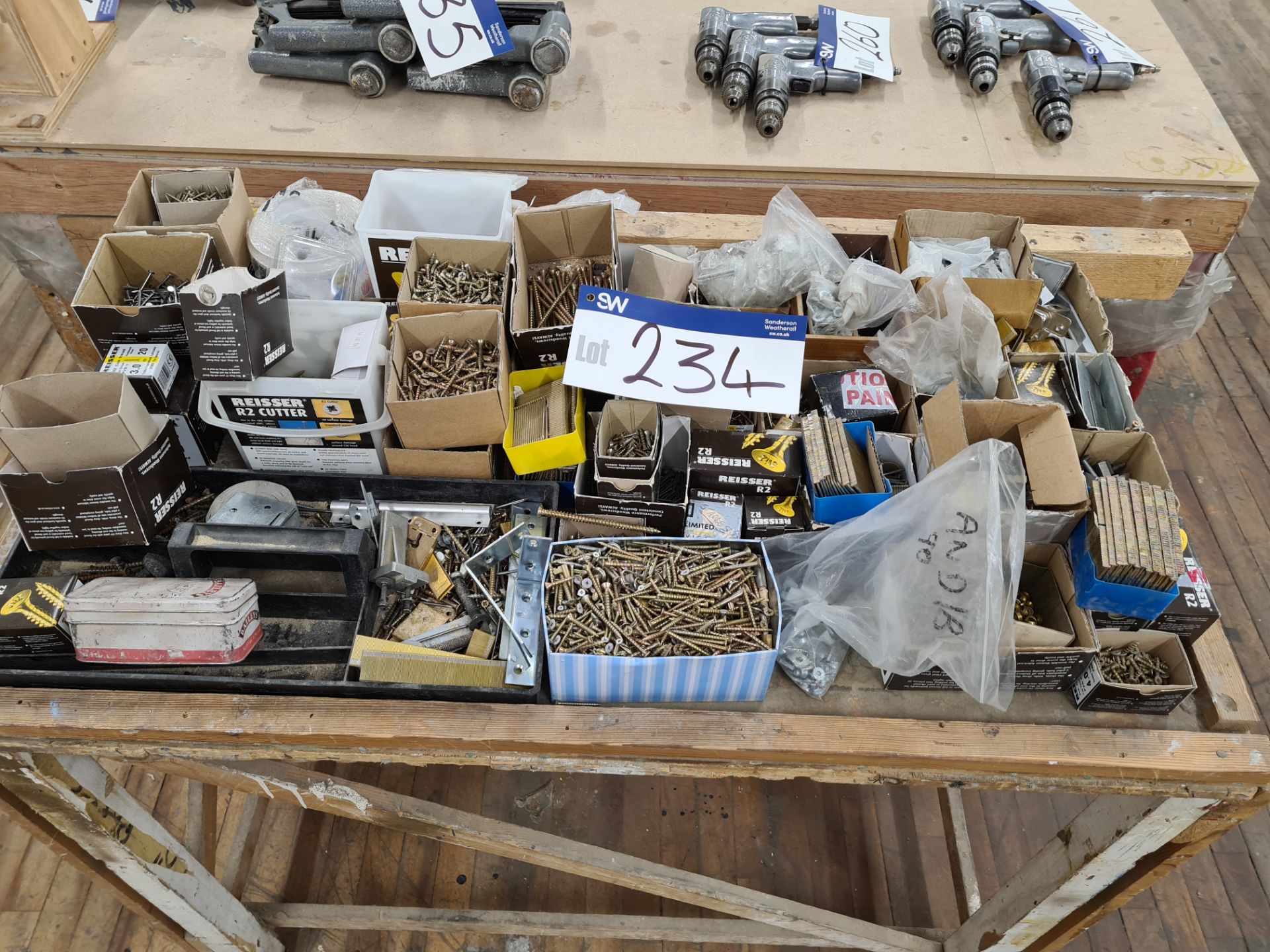 Assorted Screws, as set out on bench