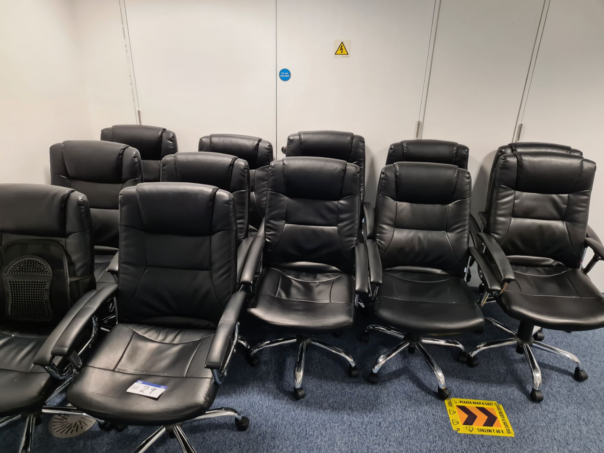 Ten leather swivel armchairs (Located at Q2 Light