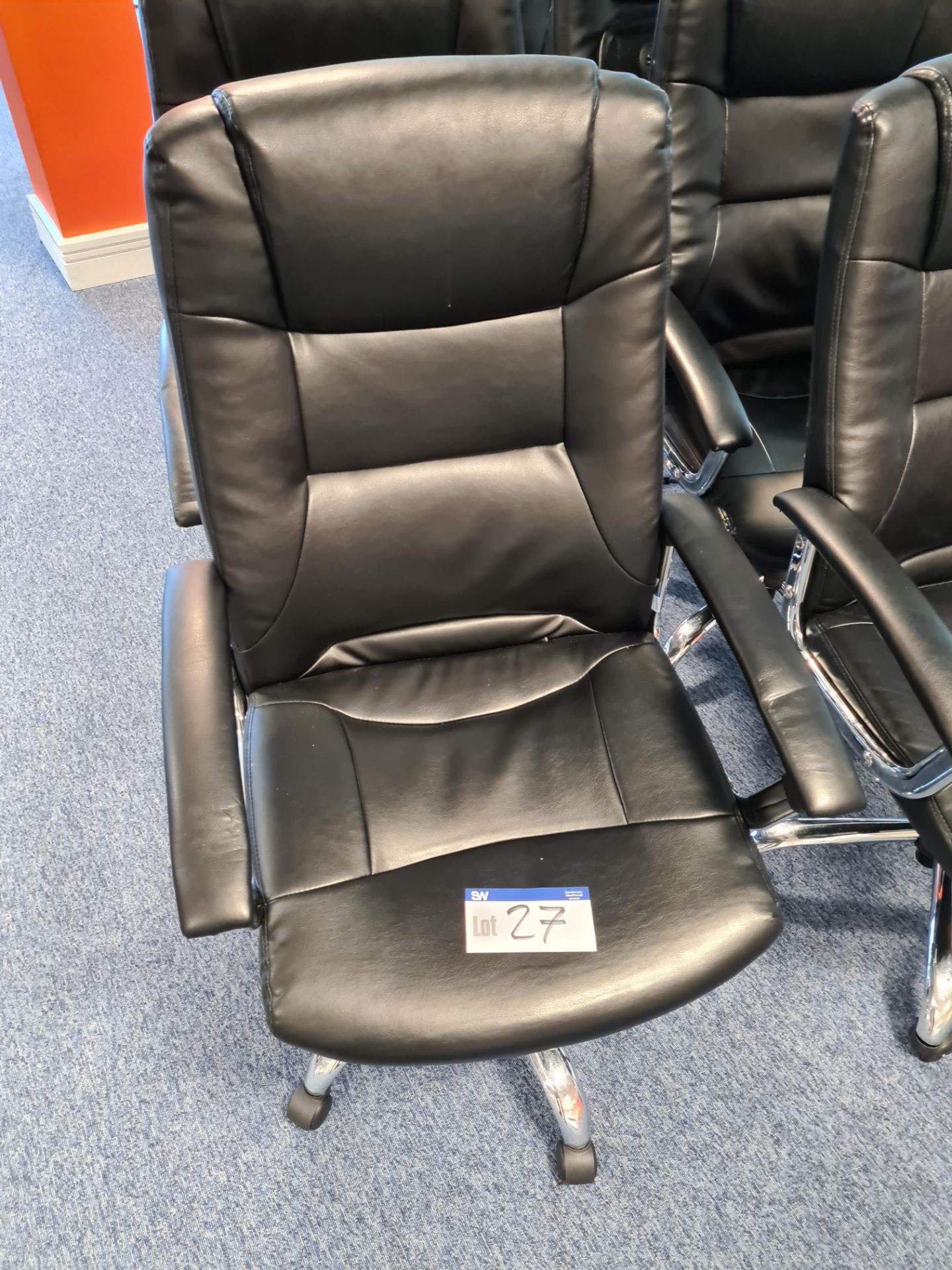 Ten Black leather swivel armchairs (Located at Q2