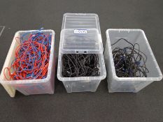 Three plastic boxes with contents including power