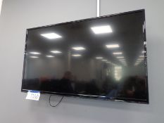 Unbranded 42” flat screen TV with remote control (