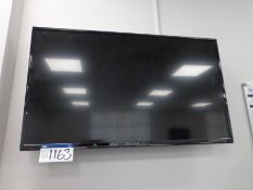 Unbranded 42” flat screen TV with remote control (