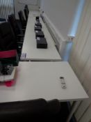 Four white melamine desks (This lot is located at