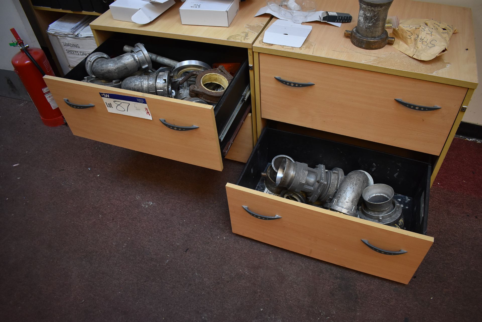 Assorted Discharge Couplings, in two drawers (located in Warehouse Office) (Offered for sale on