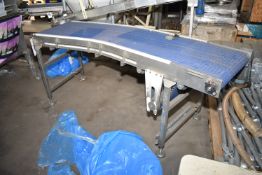 Approx. 620mm wide Plastic Belt Conveyor, approx. 2.3m long on outside radius, with geared
