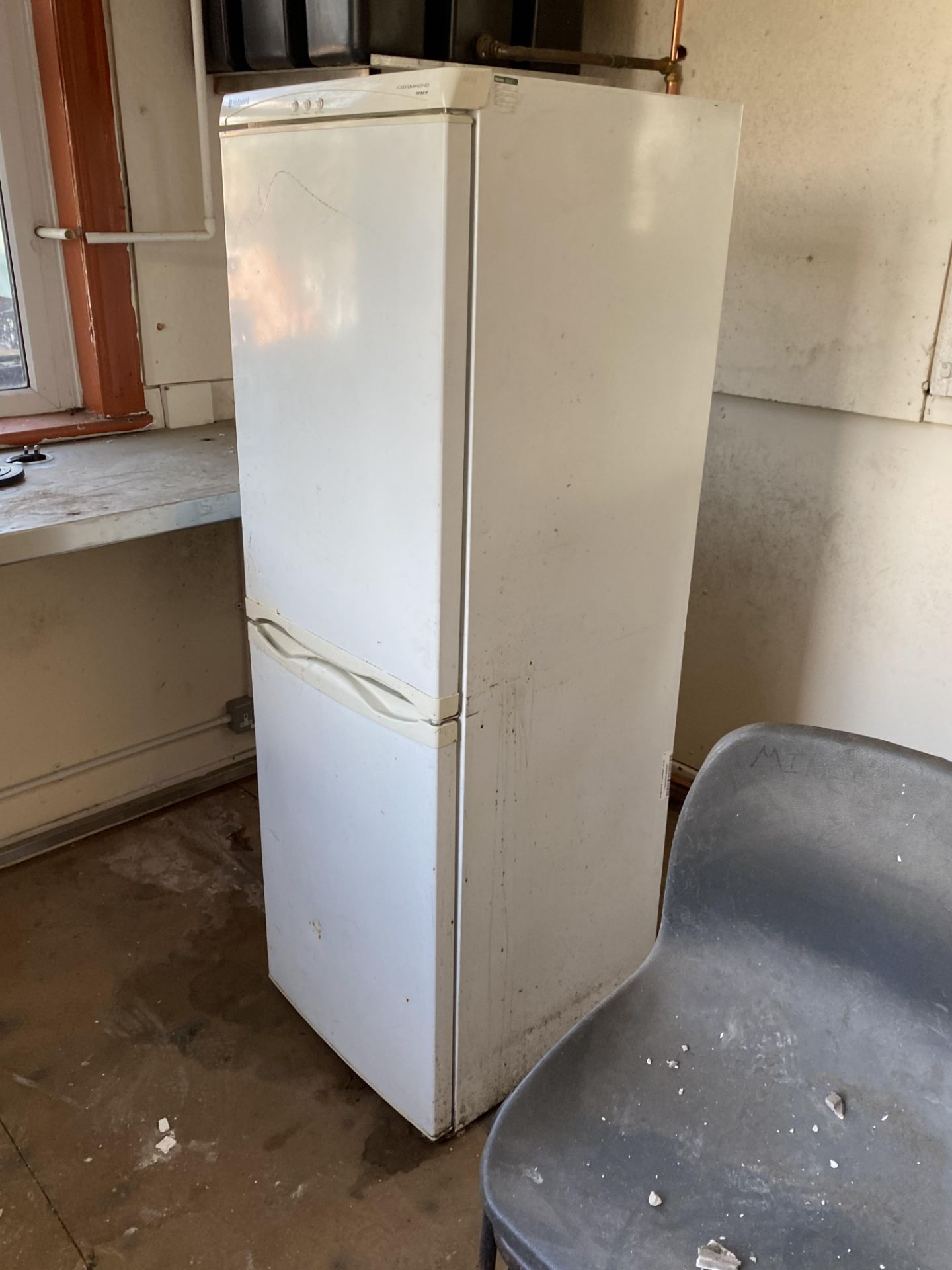 Table, with plastic stacking chairs, microwave, kettle and fridge/ freezer, in upstairs - Image 3 of 4