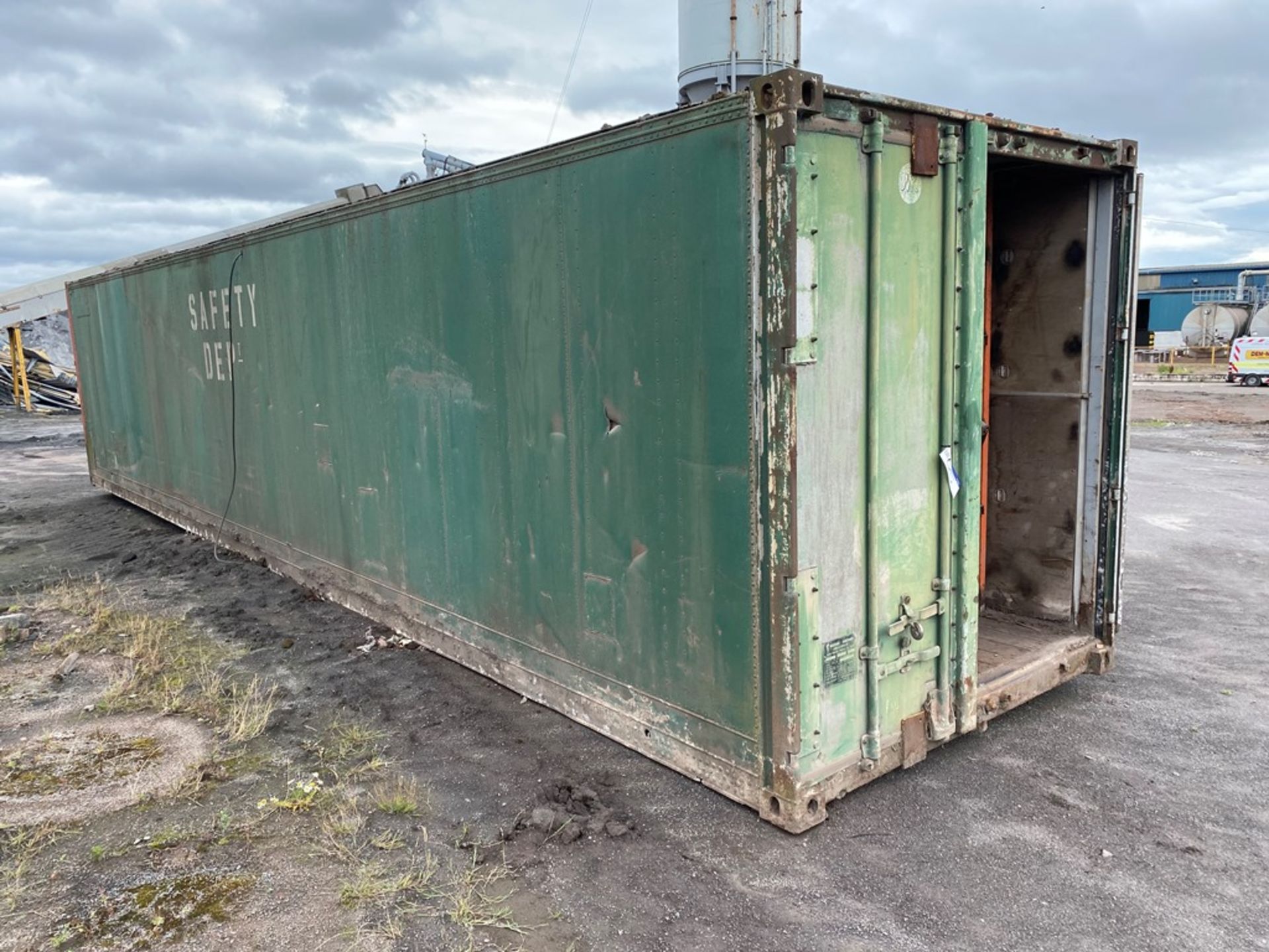 Aluminium Cargo Container, 12m long (slight hole in roof), with fitted racking inside (in yard)