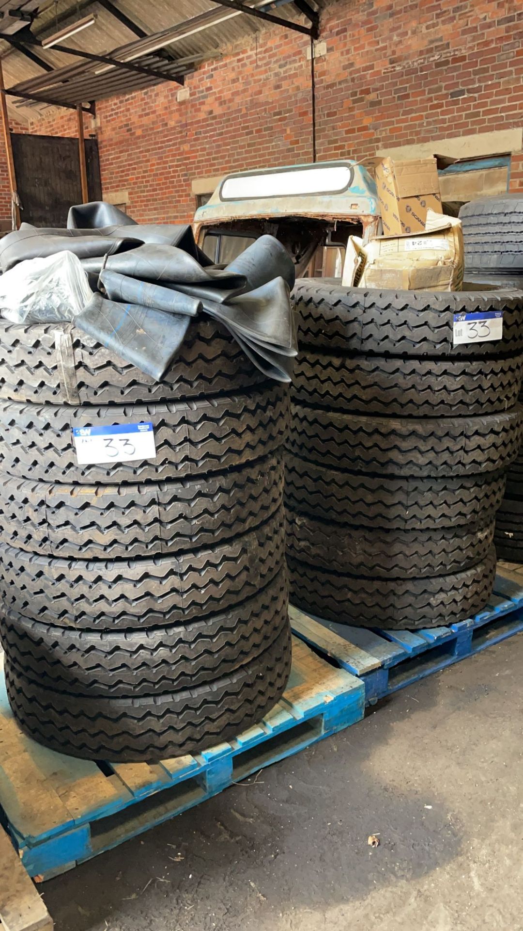 12 x 900 20 Double Coin Tyres, unused, with tubes and flaps (this lot is subject to 15% buyer's
