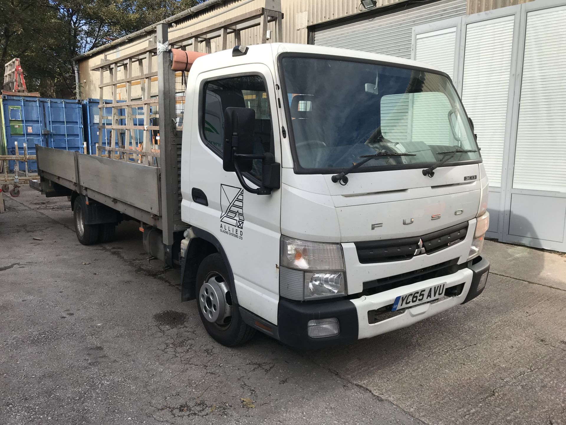 Mitsubishi Fuso Canter 3C13 Dropside Wagon, with fitted glass rack, registration no. YC65 AVU,