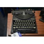 Remington COMPACT PORTABLE TYPEWRITER, with carry