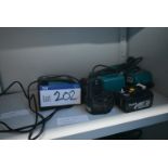 Three Makita Battery Chargers, with two batteries