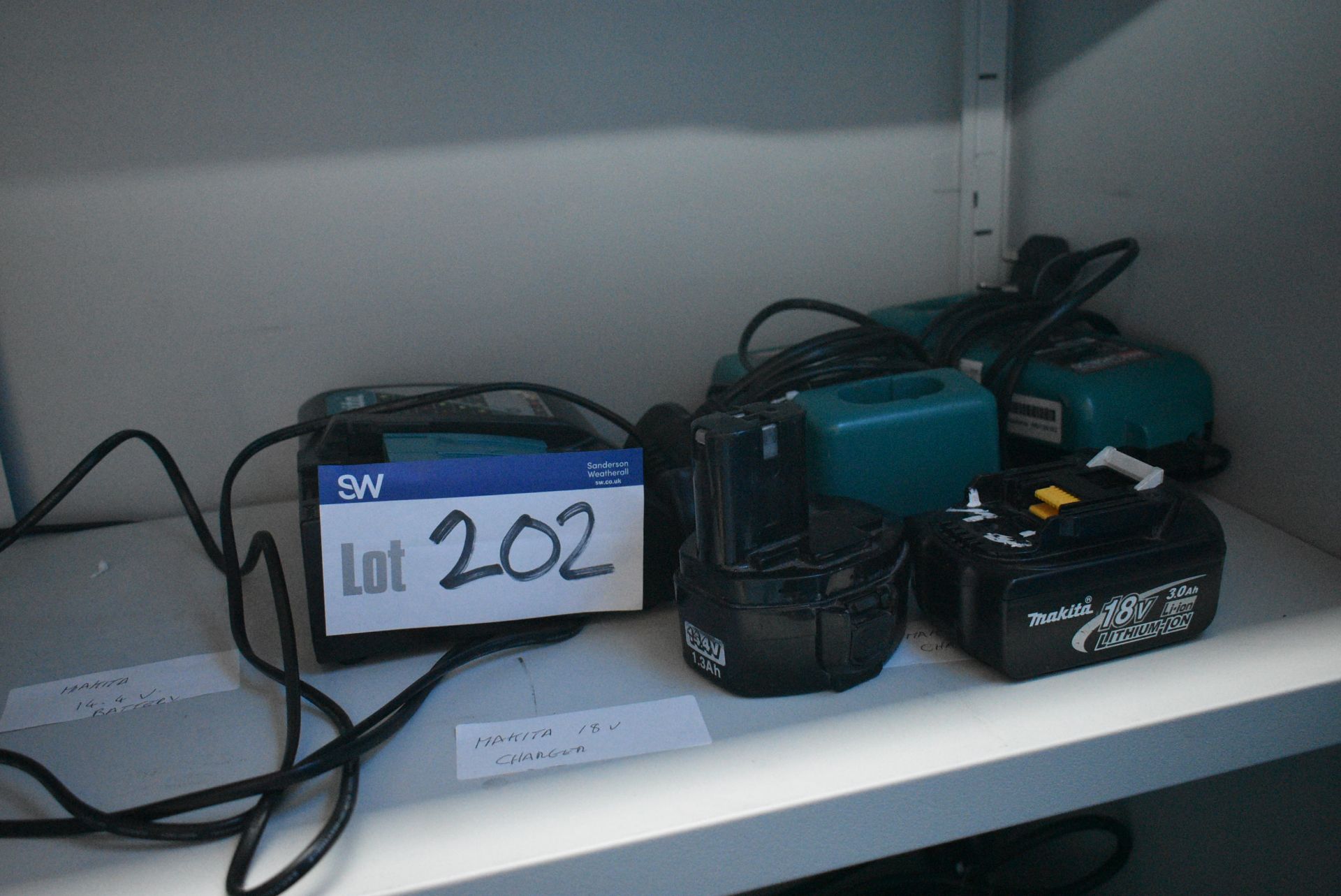 Three Makita Battery Chargers, with two batteries