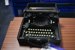 Corona Portable Typewriter, with carry case (note